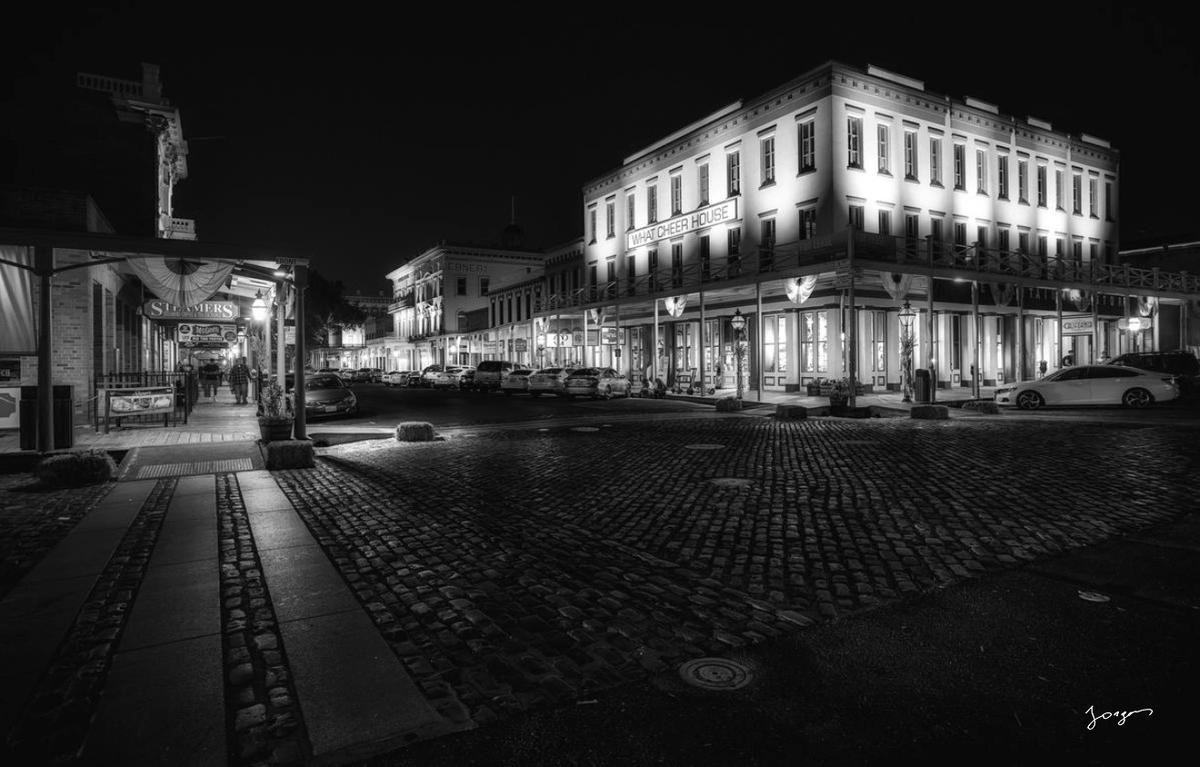 Black and white night photo of the What Cheer House on a cobblestone street in Old Sacramento California  TruLife acrylic print by Eddie Jongas