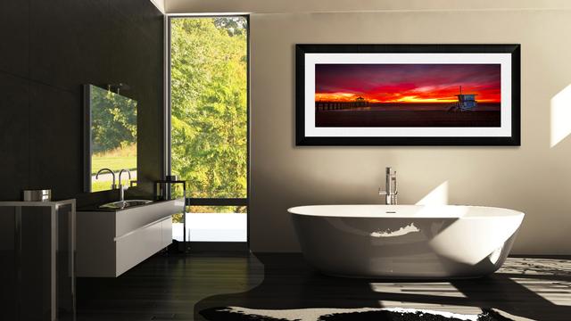 large wall art display above the bathtub and sink to the left window in the back