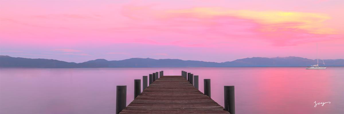 old wooden pier during pink sunset at lake tahoe panorama print by Eddie Jongas