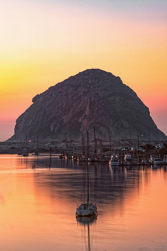 luxury fine art morro bay rock with boat during sunset