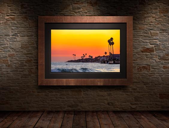 Modern wall art framed on the brick wall ocean during sunset