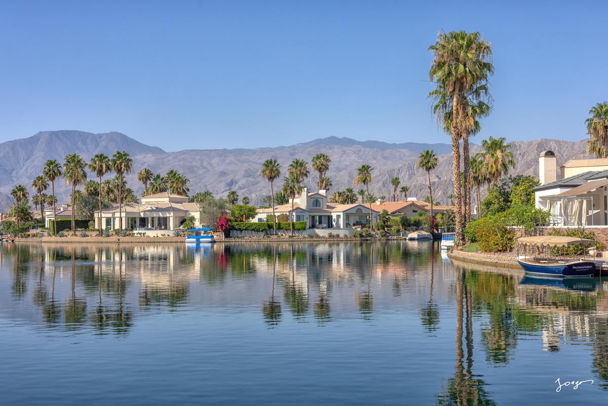 reflections of homes and palm trees on the desert lake fine art by Eddie Jongas